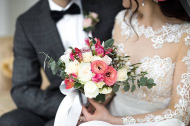 wedding bouquet in hands of the bride clipart