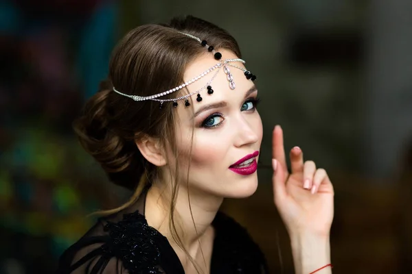 Portrait of a beautiful girl in a black negligee — Stock Photo, Image