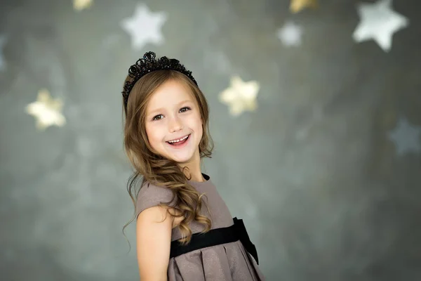 Portrait of a happy girl on a background of stars — Stock Photo, Image