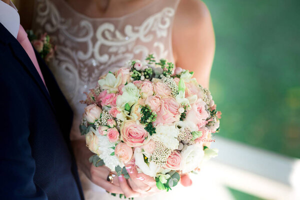 Wedding Bouquet In Brides Hands. Wedding day.
