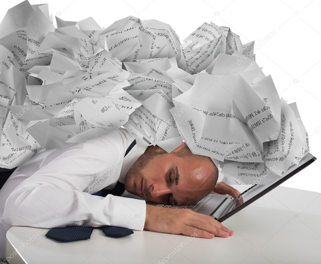 Businessman with a pile of sheets 