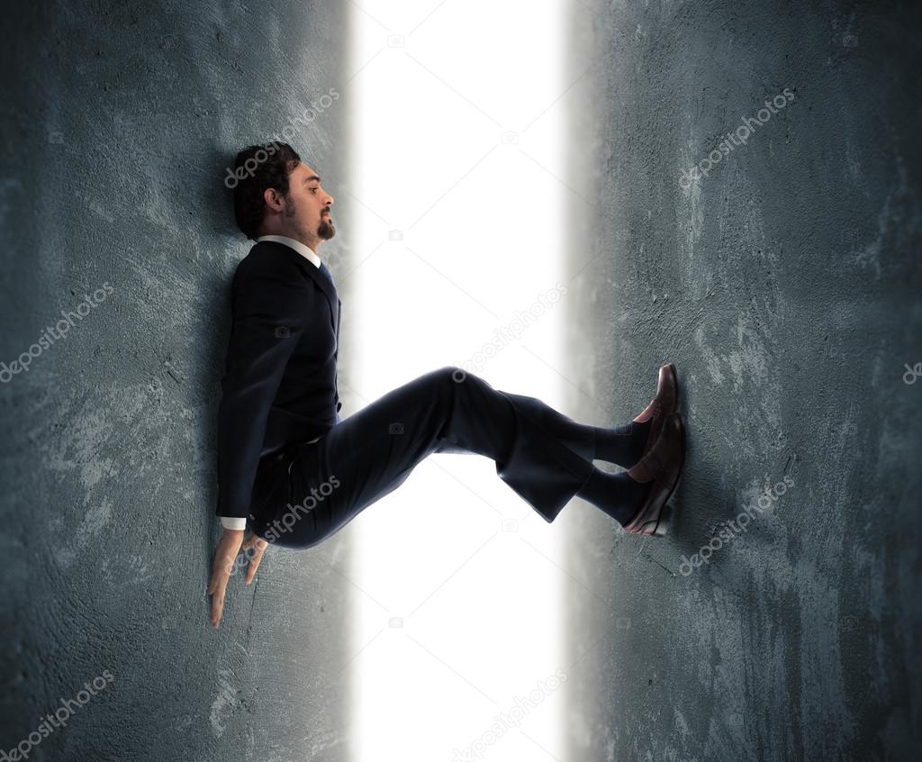 Businessman man trapped between two walls