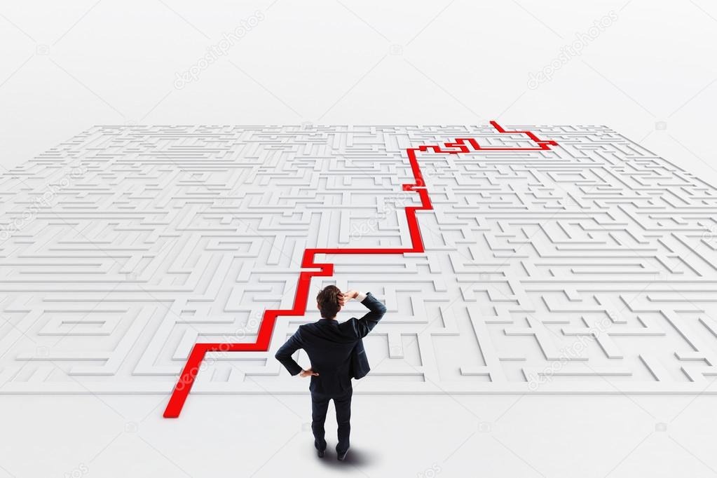 Businessman in front of a maze