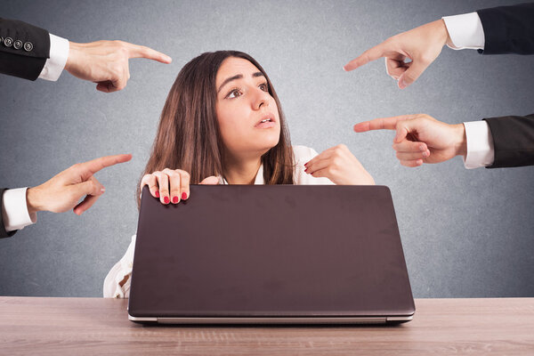 woman hidden behind a computer