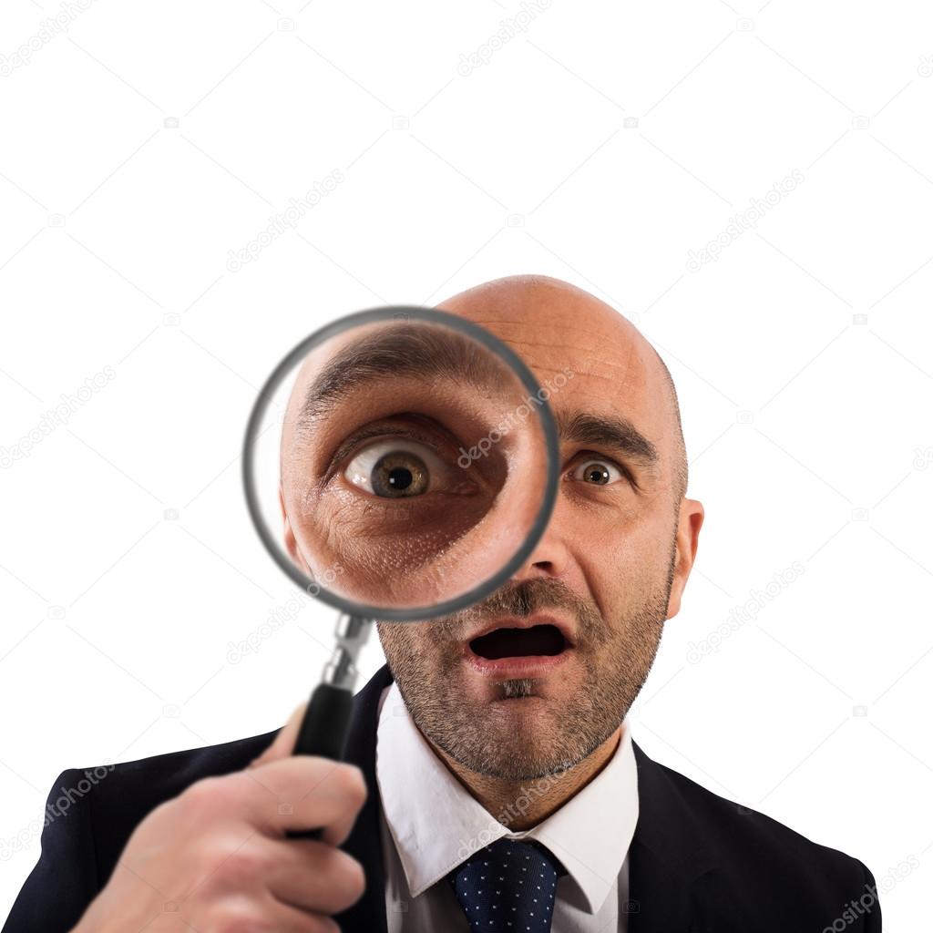Businessman with a magnifying glass