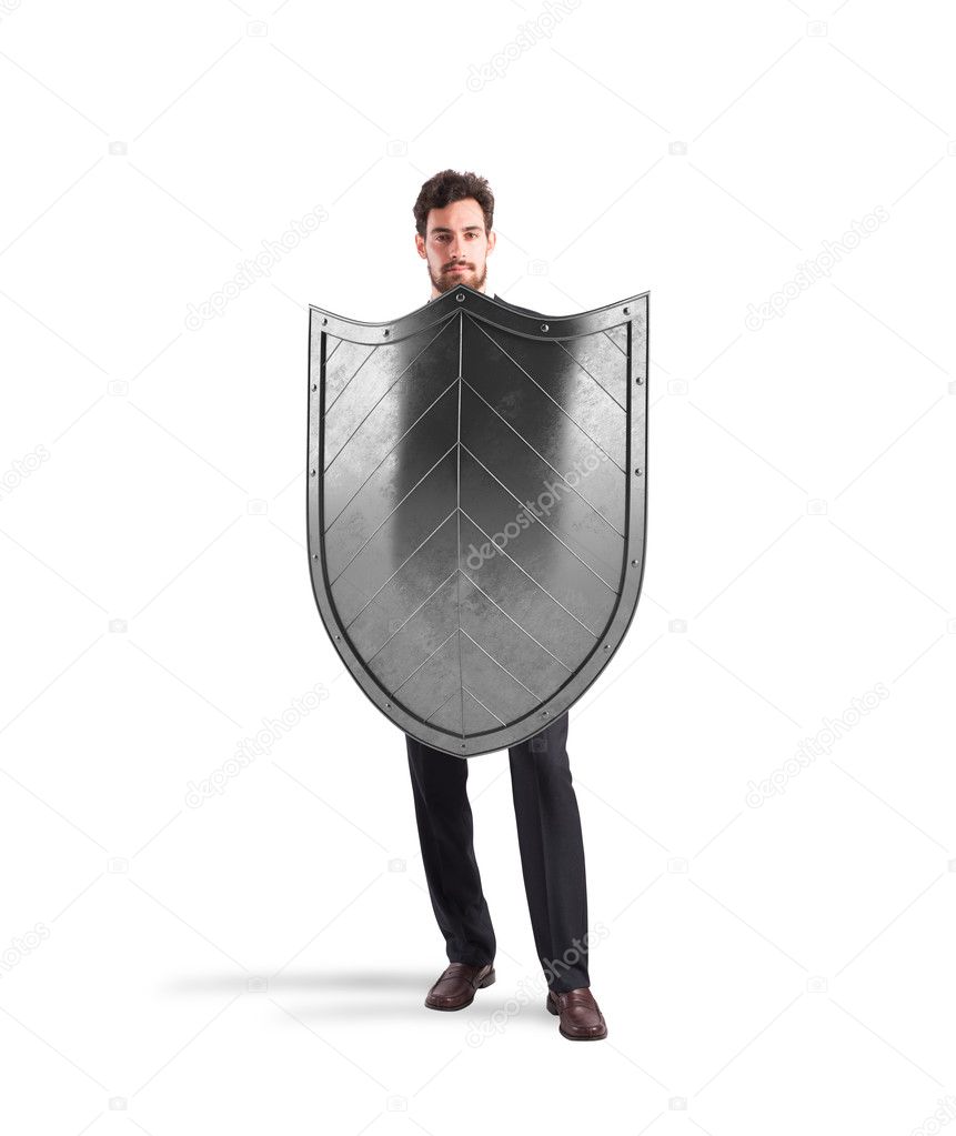 Businessman with shields. concept of protection