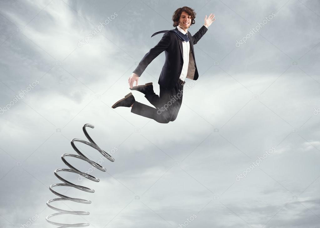 Businessman jumping high