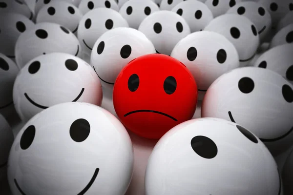 Červený míček s smutný obličej — Stock fotografie