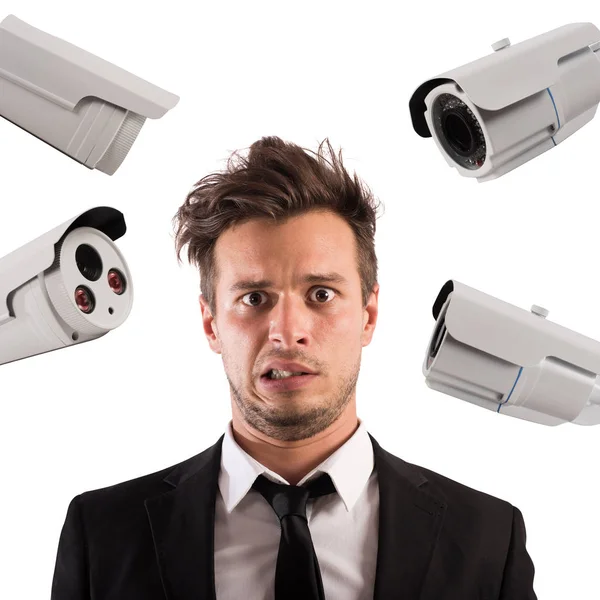 Man with cameras pointed at him — Stock Photo, Image