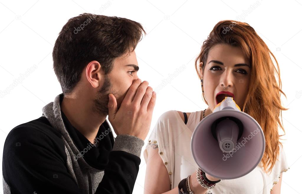Man talking the ear of another girl 