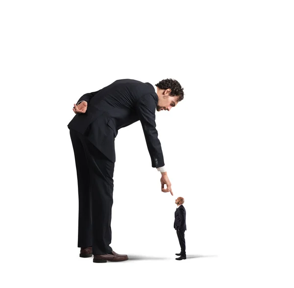 Businessman  pointing a small man — Stock Photo, Image