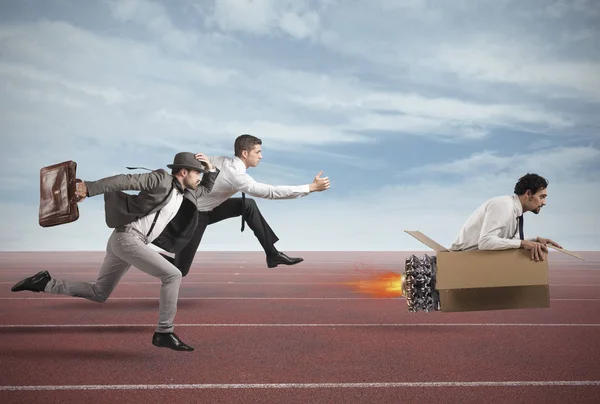 Businessman with cardboard missile overcomes — Stock Photo, Image