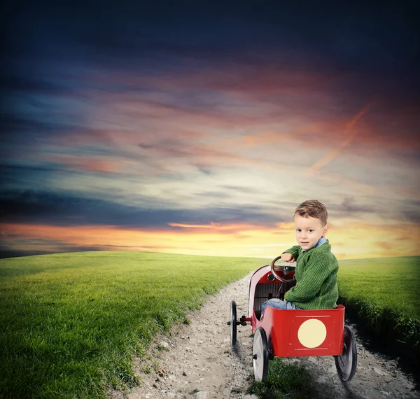 Child with car plays — Stock Photo, Image