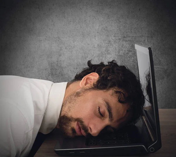 Essman exhausted from overwork sleeping Stock Photo