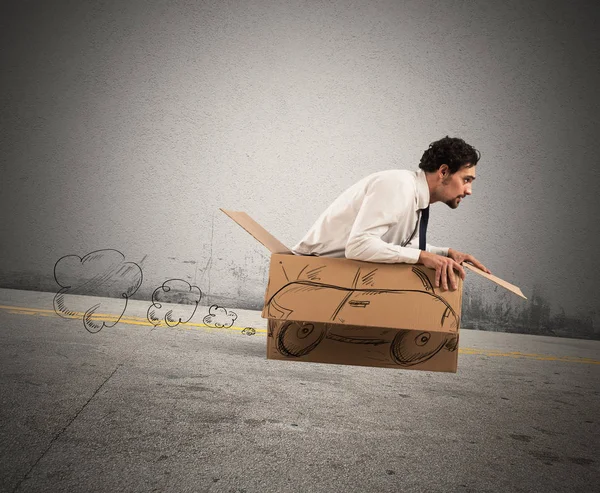 E man driving  on  his cardboard car — Stock Photo, Image