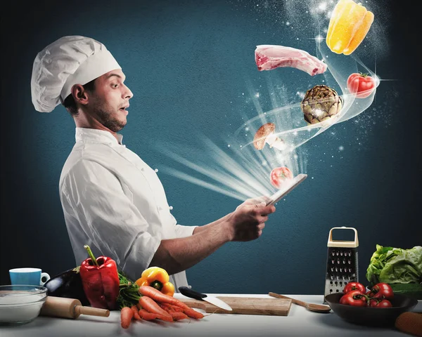 Chef reads a food recipe — Stock Photo, Image