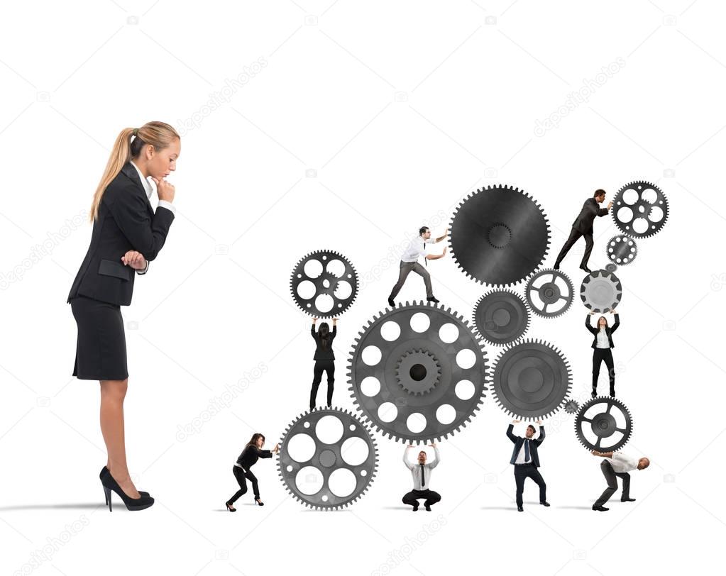 Businesswoman watches a teamwork
