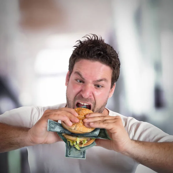 Homem de negócios ganancioso e gordo come — Fotografia de Stock