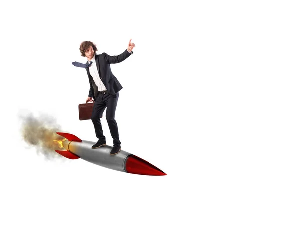 Uomo d'affari che vola sopra un razzo — Foto Stock