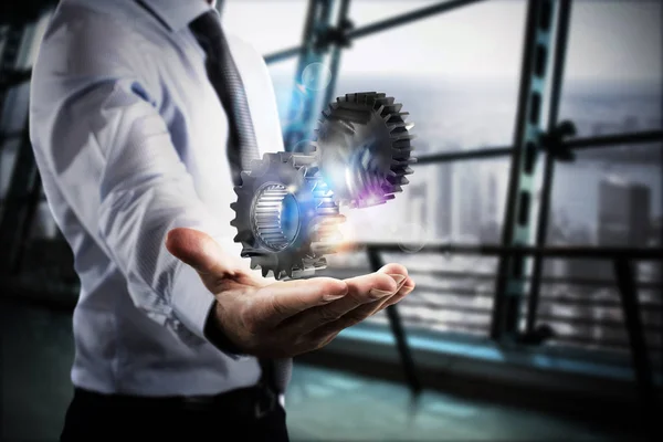 Geschäftsmann hält ein System in der Hand — Stockfoto