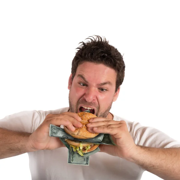 Бизнесмен ест сэндвич с банкнотами — стоковое фото