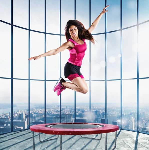 Fitness teacher jumps nimbly — Stock Photo, Image