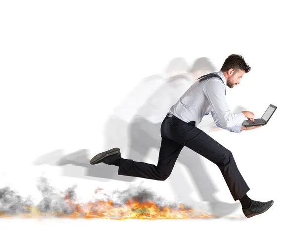 Businessman runs quickly with laptop — Stock Photo, Image