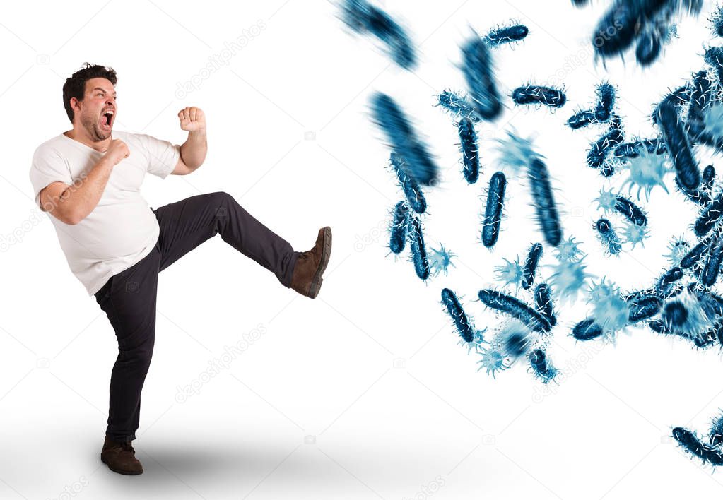 man kicks an attack of bacteria.