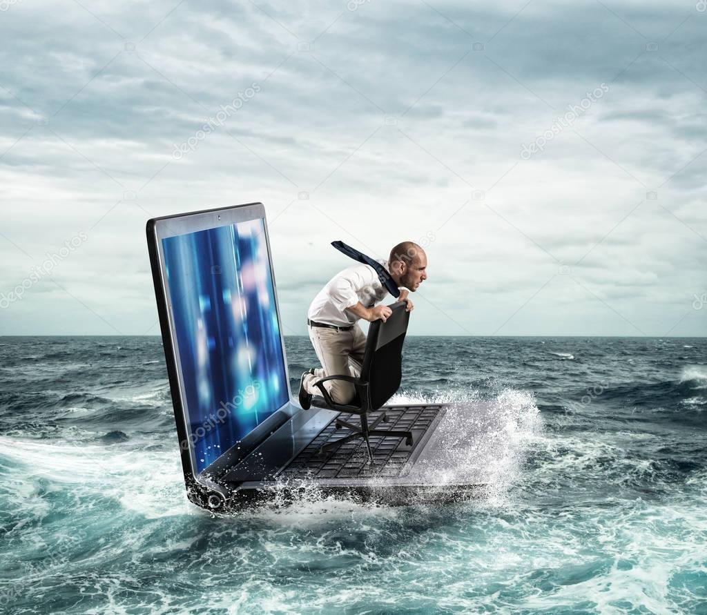 Businessman sailing on a laptop