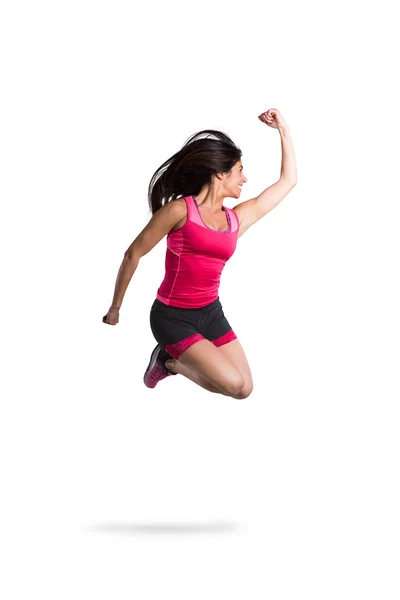 Zásadní a sportovní dívka skáče — Stock fotografie