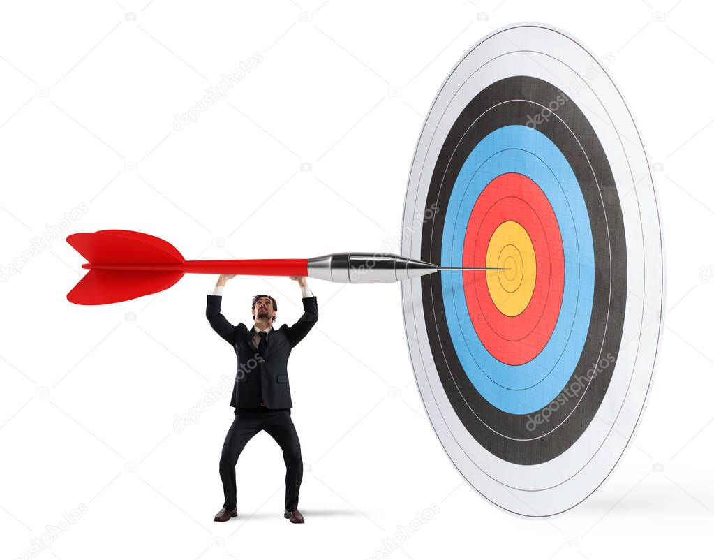Businessman puts dart in the  center