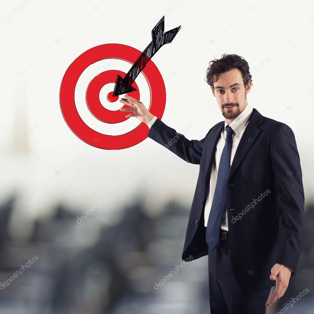 Businessman drawing a target