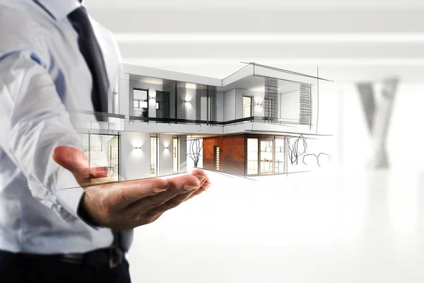 Businessman showing a modern office project — Stock Photo, Image