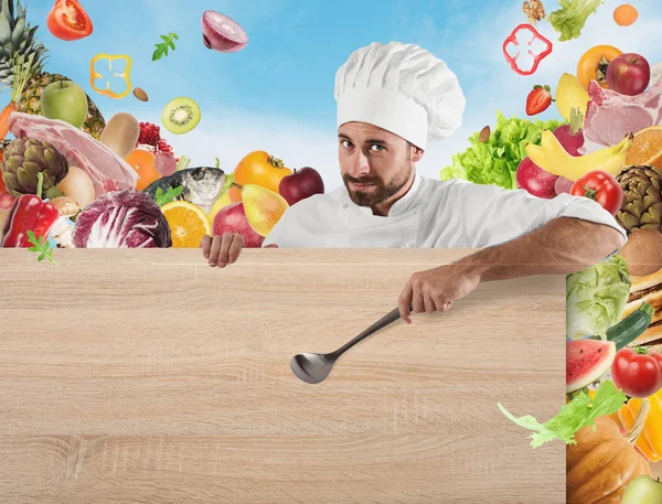 Chef-kok met bestuur en groenten achtergrond — Stockfoto