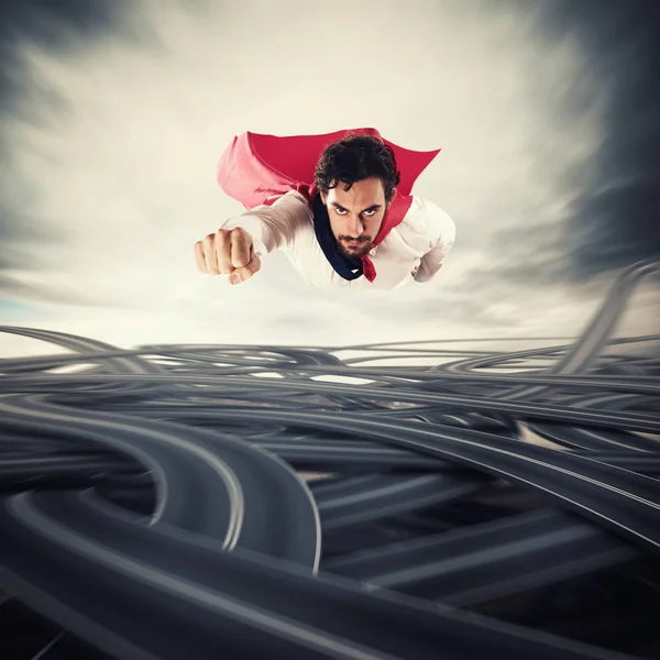 Male superhero with read cloak flying — Stock Photo, Image