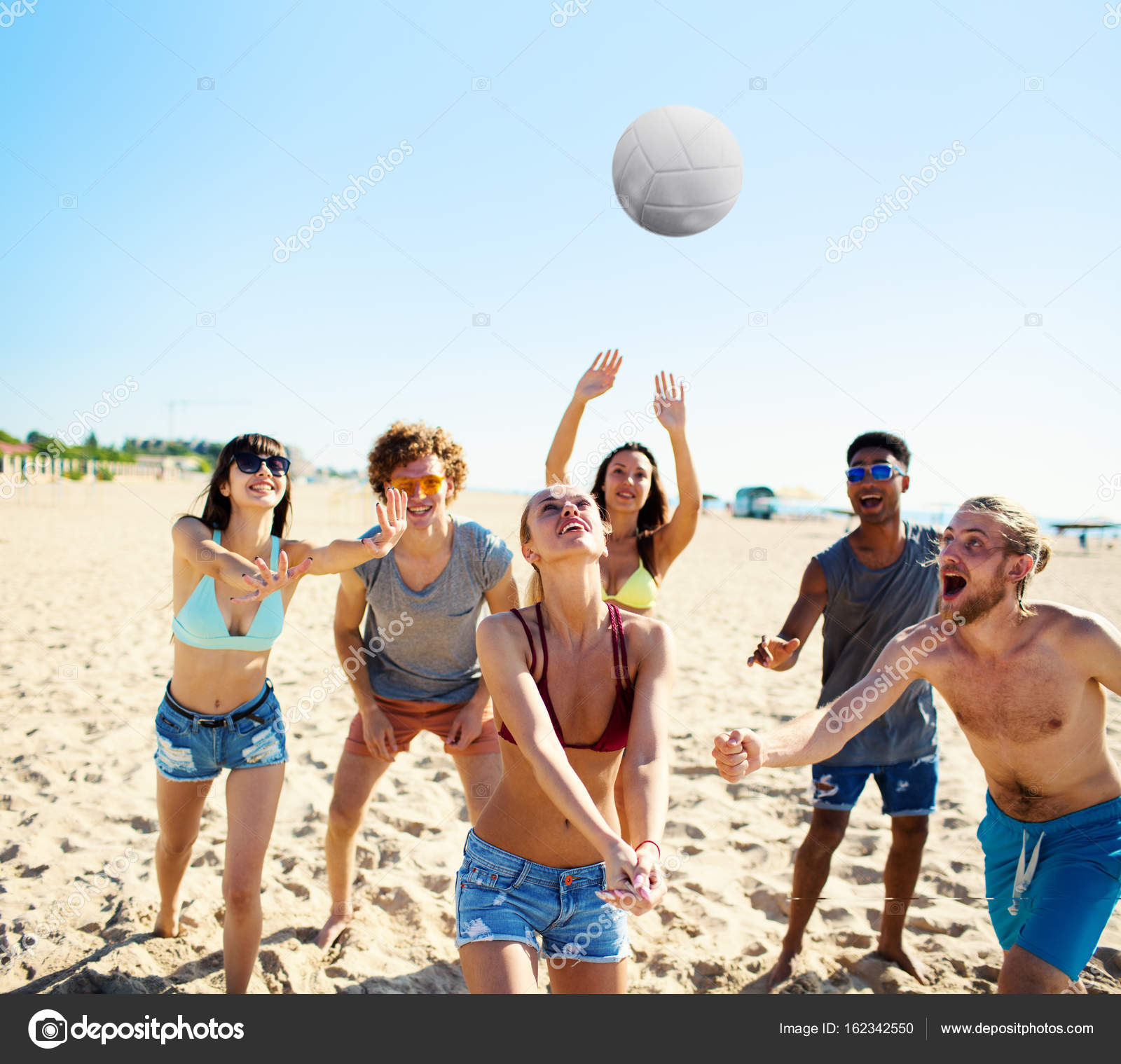 Group Of Friends Playing At Beach Volley At The Beach Stock Photo Image By C Alphaspirit 162342550