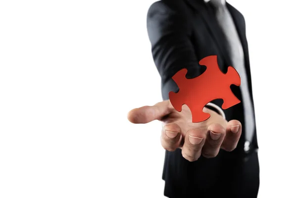 Businessman  inserting a missing piece — Stock Photo, Image