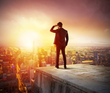 Businessman looking  at the city 