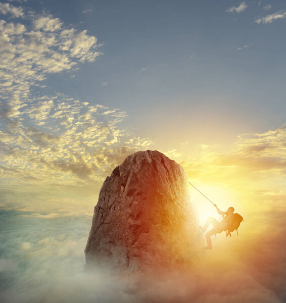 Businessman climbing  a mountain 