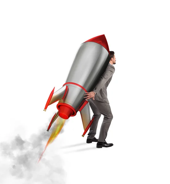 Бизнесмен держит ракету — стоковое фото