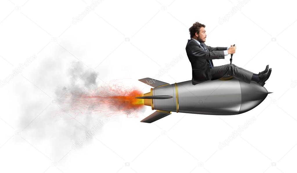 Businessman flying on a fast rocket.