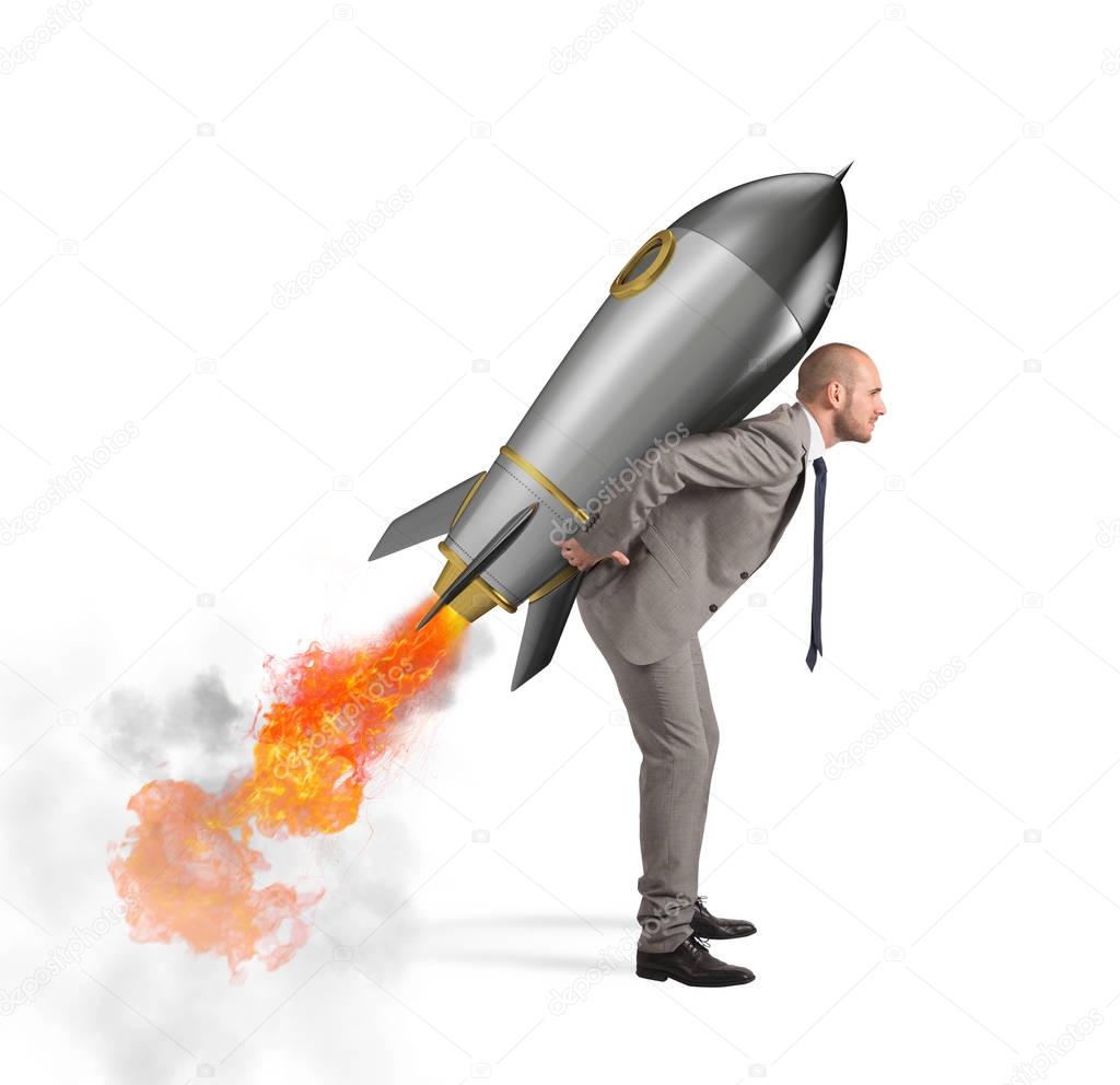 Businessman holding a missile