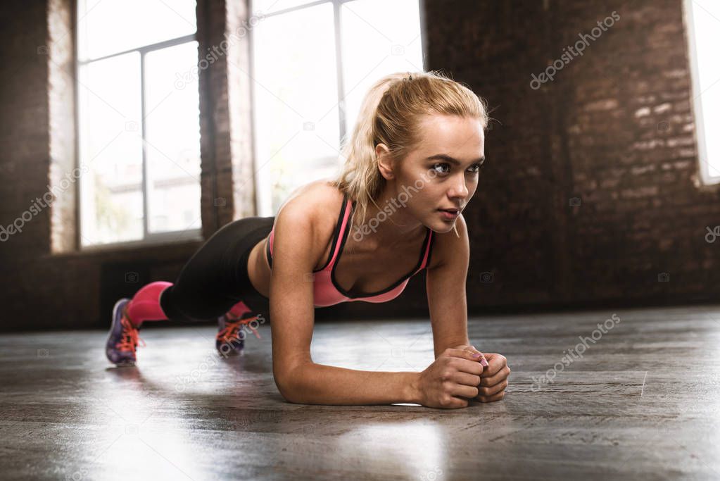 Blonde girl working out at a gym