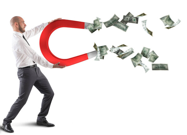 Businessman with a big magnet 