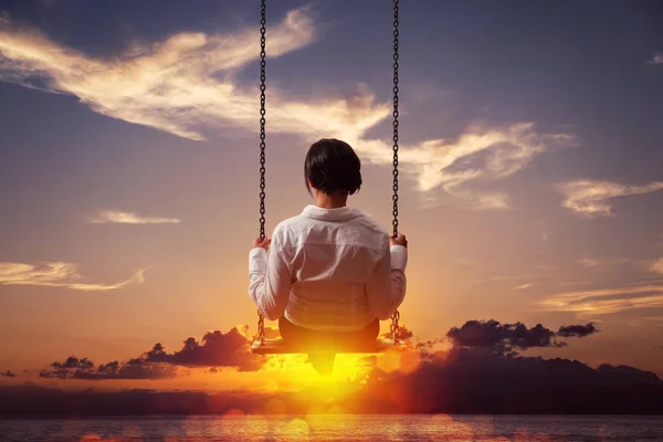 Freedom and carefree of a young female on a swing — Stock Photo, Image