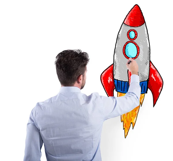 Businessman drawing a rocket. Concept of business improvement and enterprise startup — Stock Photo, Image