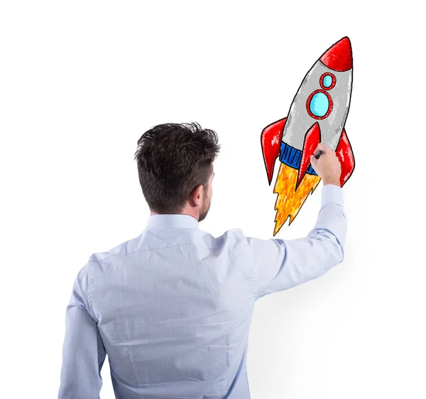 Businessman drawing a rocket. Concept of business improvement and enterprise startup — Stock Photo, Image