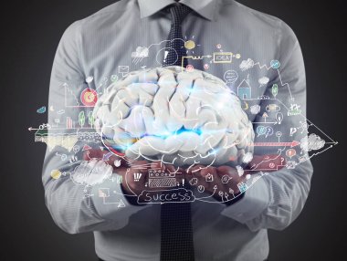 Man holds a brain with business drawing sketches on his hands. 3D Rendering clipart