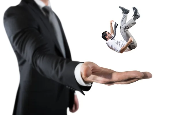 Businessman is saved from a big hand. Concept of business support and assistance — Stock Photo, Image