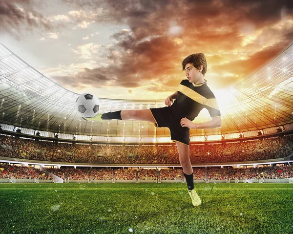 Football scene with competing young football players at the stadium — Stock Photo, Image